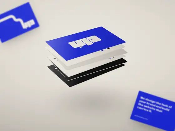 A floating stack of business cards in blue, bone and ink