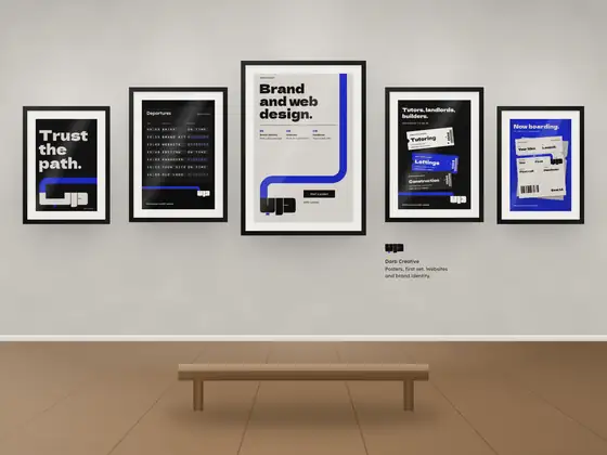 Five of our posters framed on a gallery wall
