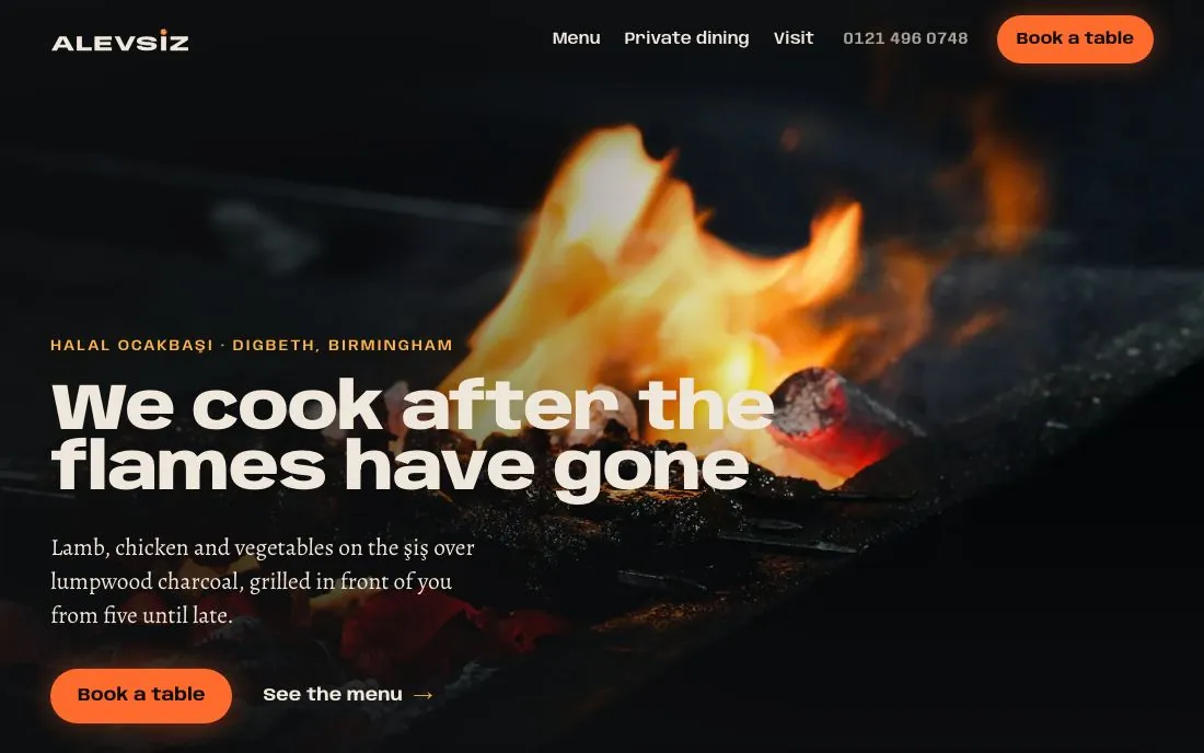 The top of a grill restaurant's website we designed: a dark photo of charcoal flames, the heading We cook after the flames have gone, and an orange Book a table button